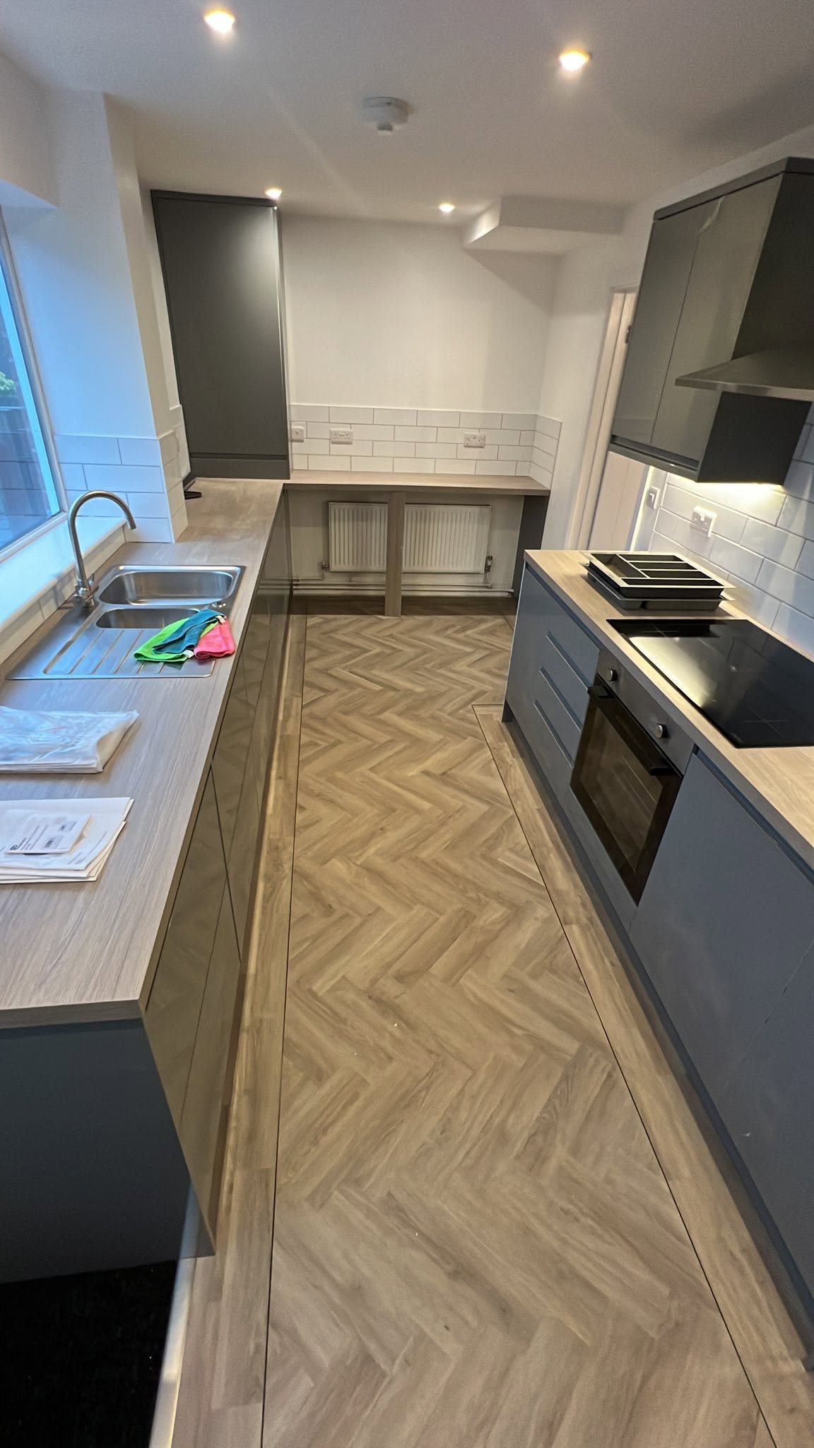 Galley kitchen with herringbone LVT