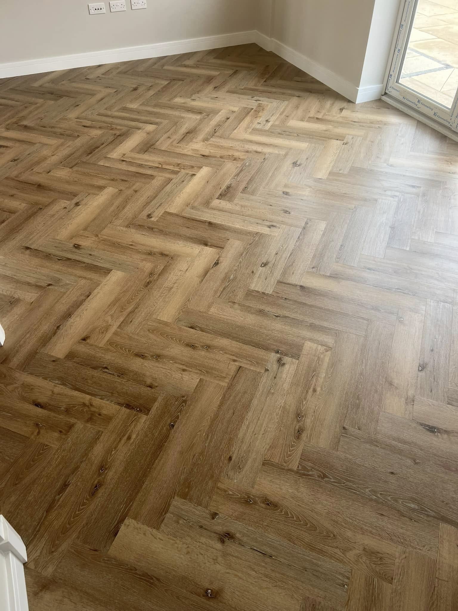 Oak herringbone floor in a sunny living room