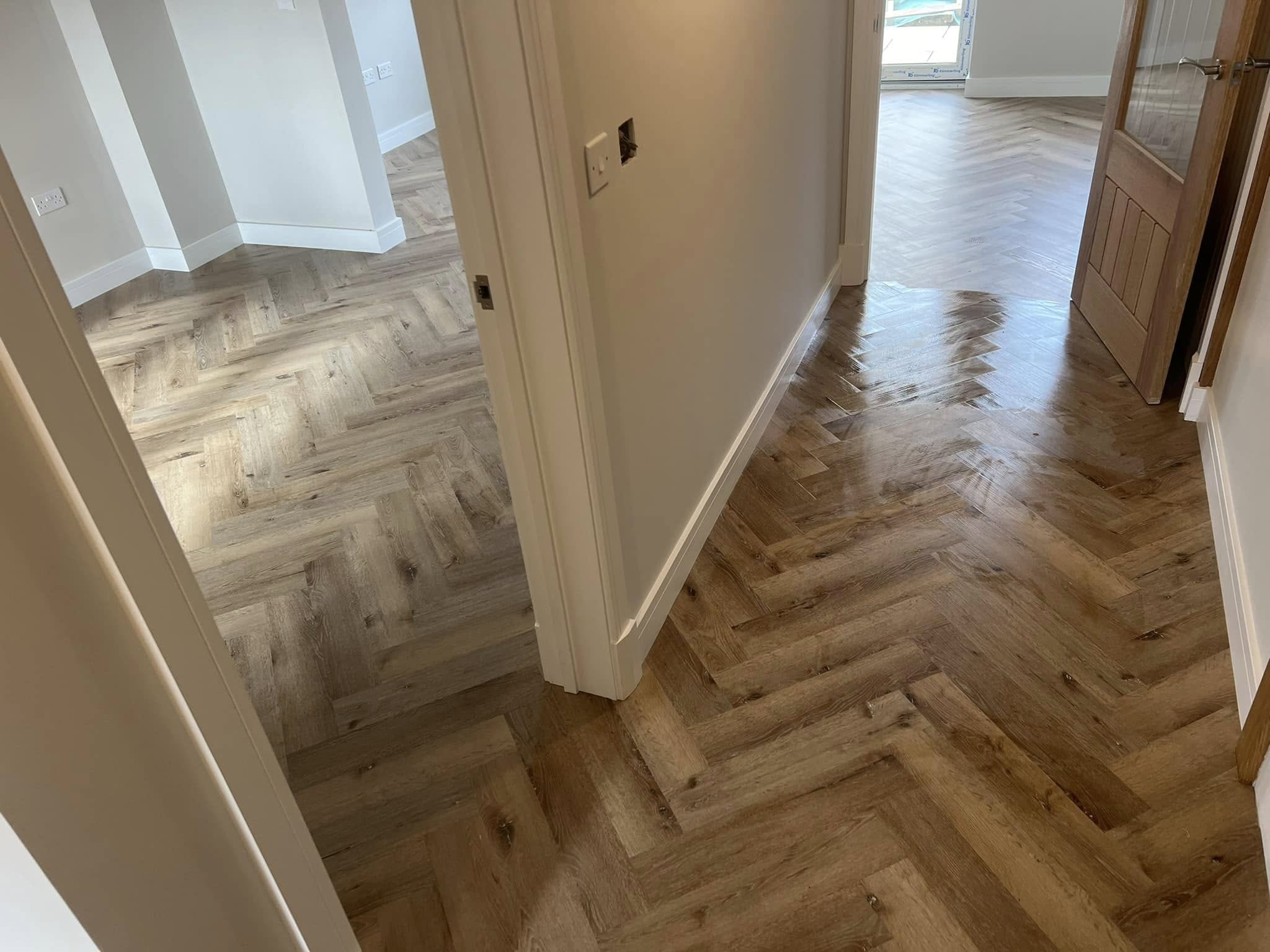 Herringbone flowing between two rooms through a doorway