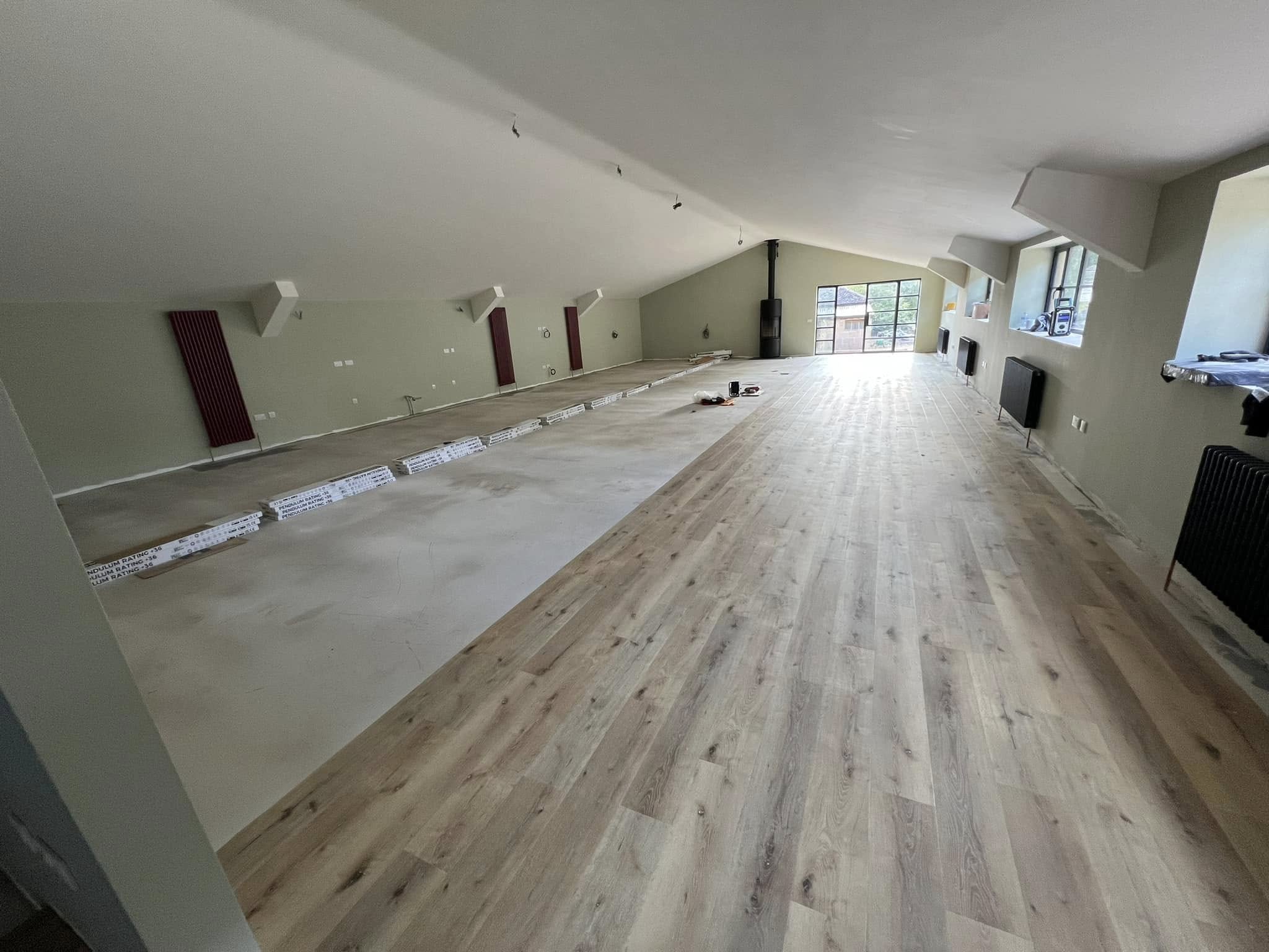Plank LVT laid across half of the long room