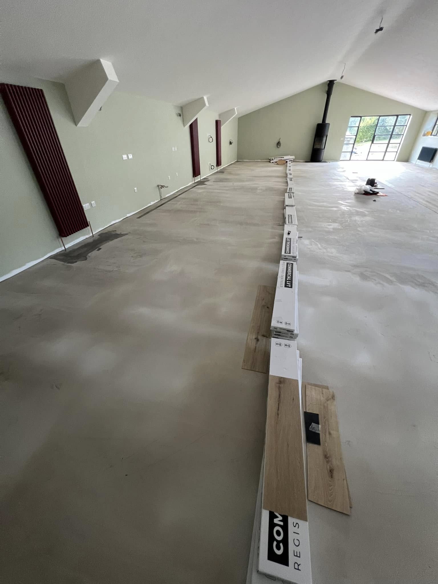 First rows of plank LVT laid along a smooth levelled floor