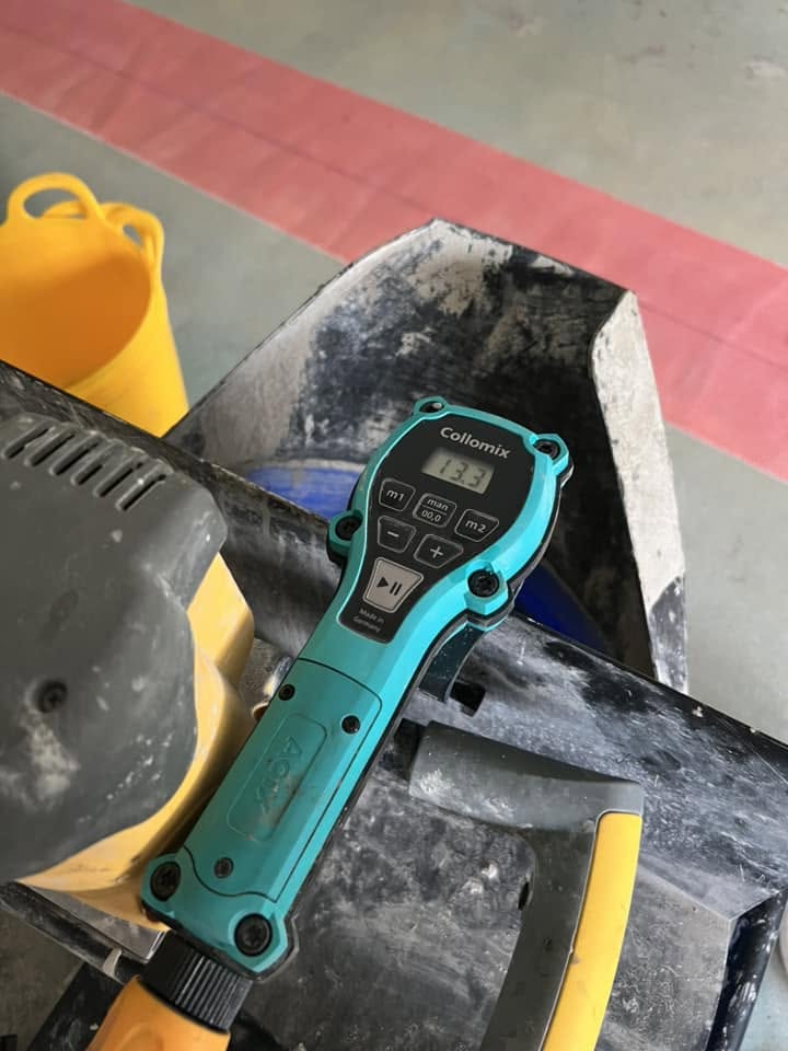 Moisture meter resting on the prepared floor